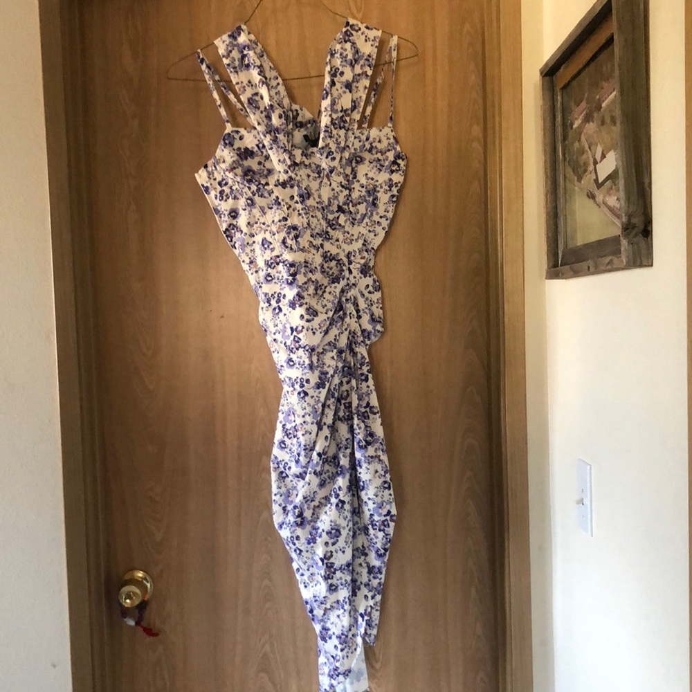 Lilac floral dress with tags still attached.